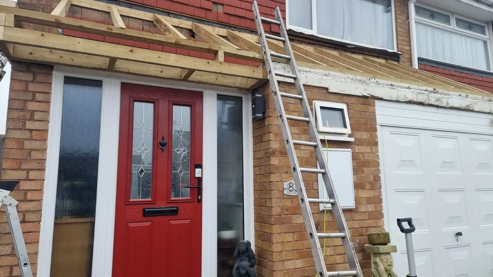 New timber roof structure over a porch during building work by Westridge Roofing Birmingham