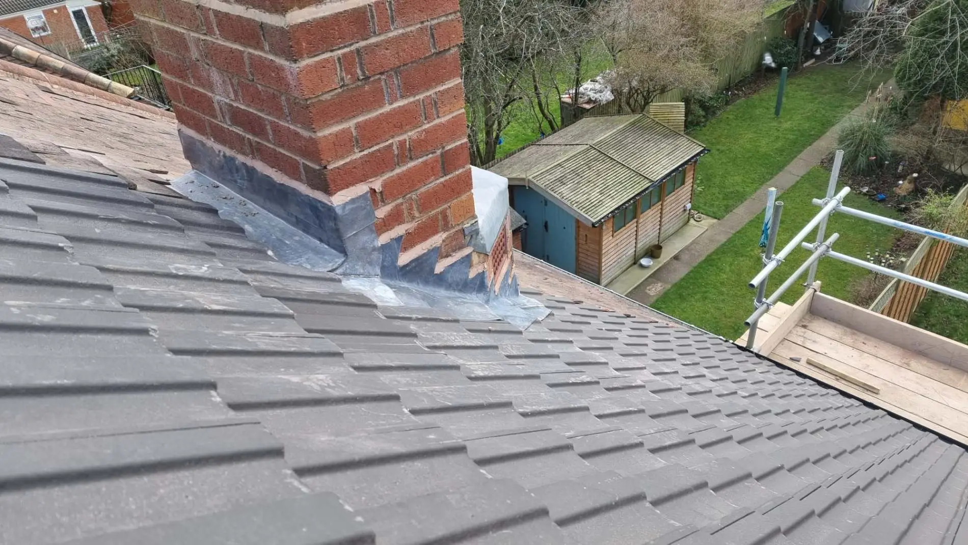 Chimney stack with new lead flashing on a re-tiled roof Westridge Roofing Birmingham