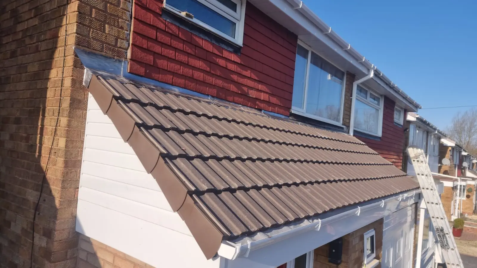 New tiled roof and white uPVC fascia fitted by Westridge Roofing Birmingham