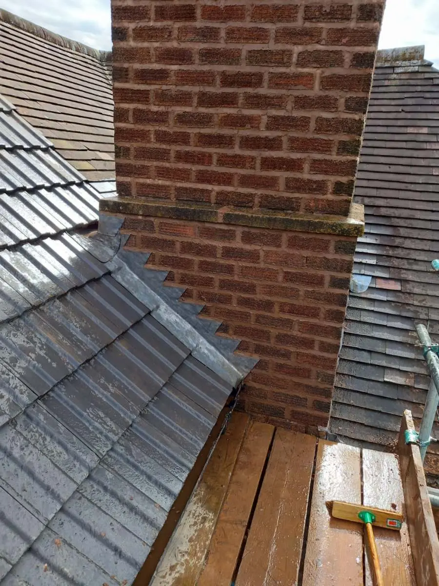 Guttering and roofline being cleaned on a Solihull property Westridge Roofing