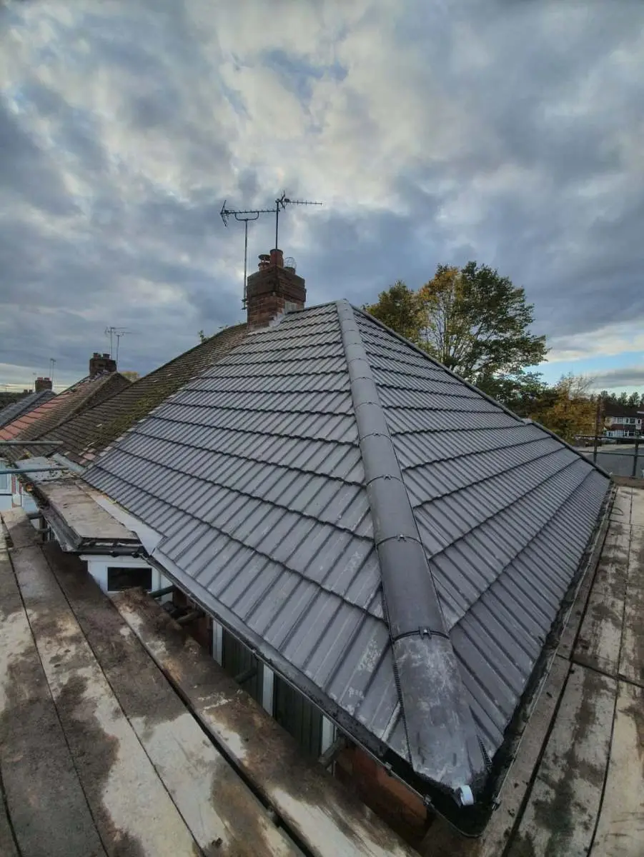 Guttering and downpipe maintenance on a house in Sutton Coldfield Westridge Roofing